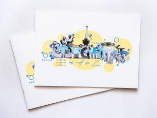 Białe książeczki z grafiką przedstawiającą symbole miasta i napis "Tychy".